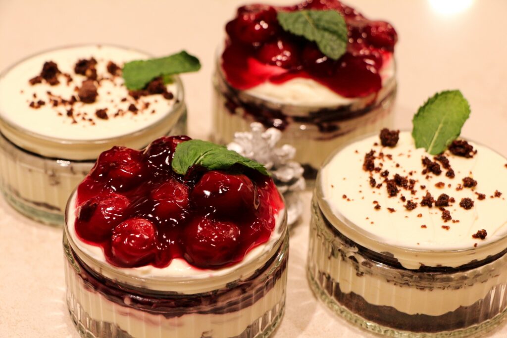 three small desserts are sitting on a table.