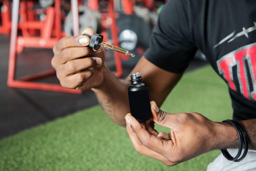 a man holding a lighter and a lighter in his hand.