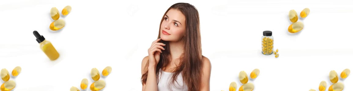 a woman with long hair standing in front of a white background.